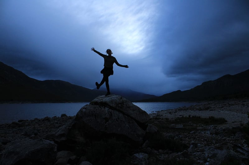 Silhouette of a person at sunset